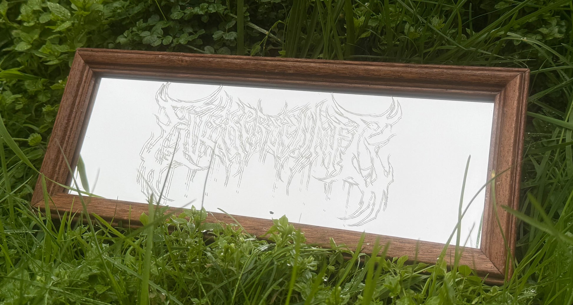 Wooden framed etched mirror in clover